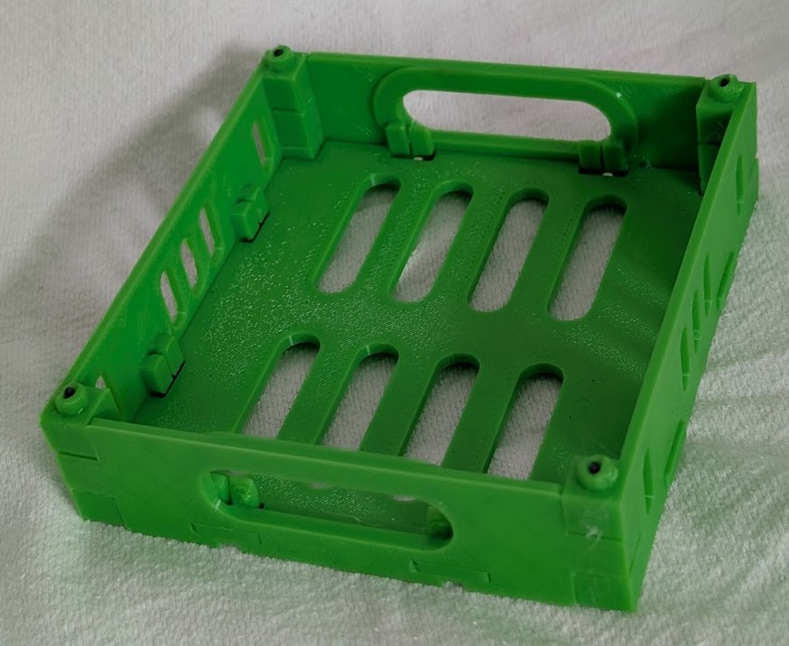 Final green A1 Mini flat-pack crate assembled in PLA